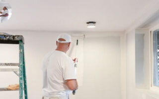 how much does a house painter make an hour