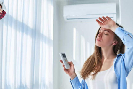 why does my house feel damp with ac on